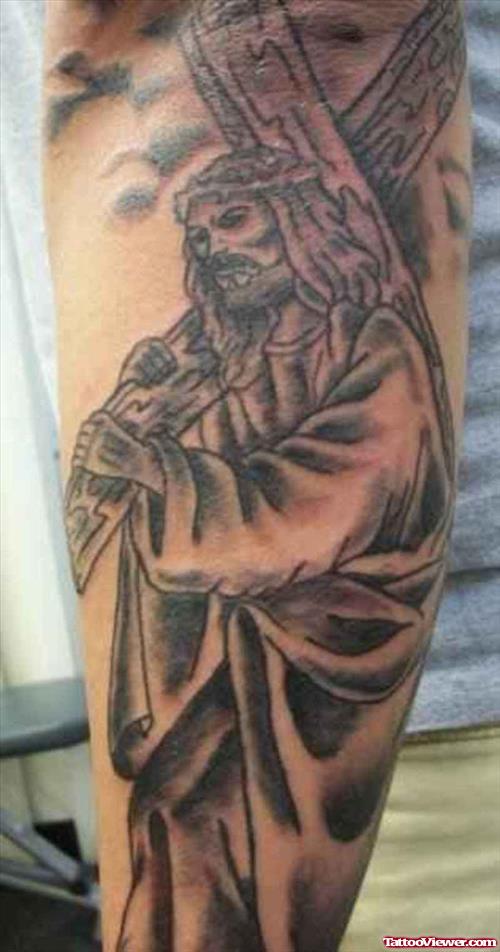 Grey Ink Jesus With Cross Tattoo On Right Sleeve