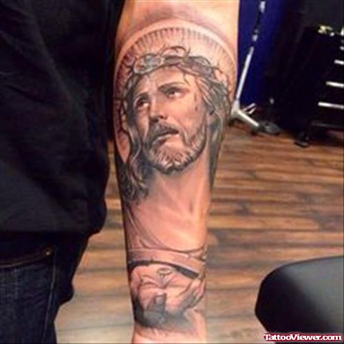 Grey Ink Jesus Head Tattoo On Left Arm