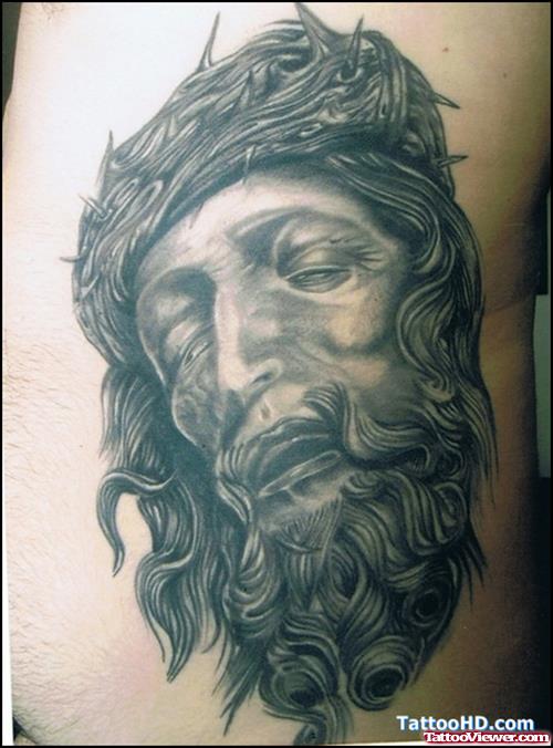 Attractive Grey Ink Jesus Head Tattoo On Side Rib