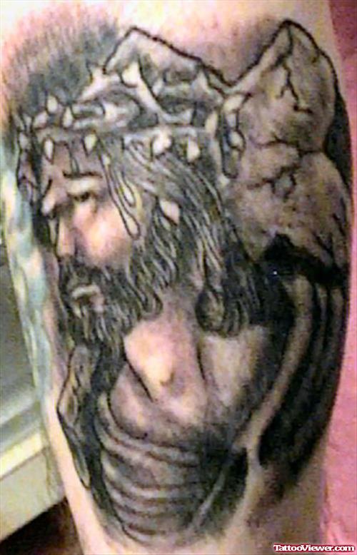 Grey Ink Jesus Christ Tattoo On Bicep