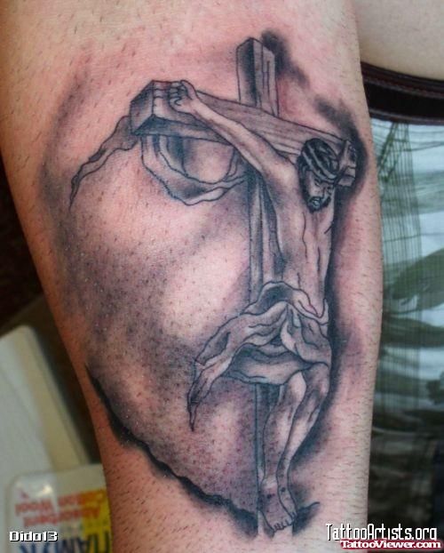 Grey Ink Cross With Jesus Tattoo On Sleeve