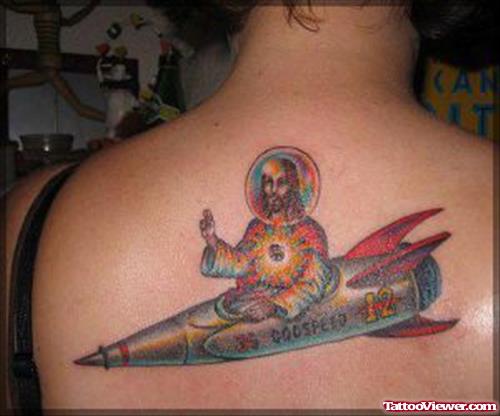 Colored Jesus Christ In Rocket Tattoo On Back