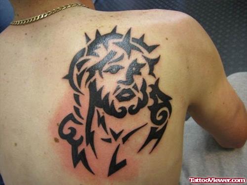 Black Ink Tribal Jesus Tattoo On Right Back Shoulder