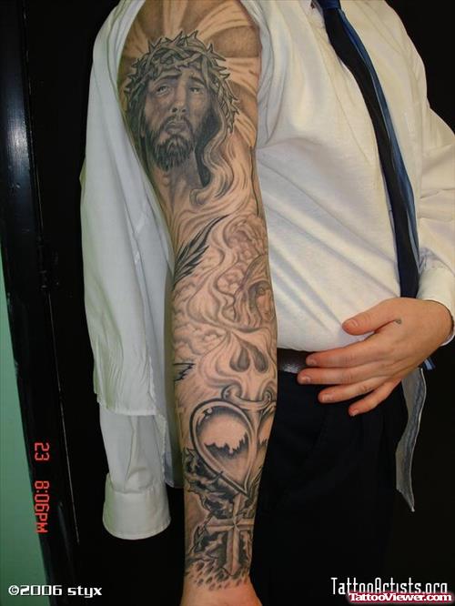 Grey Ink Jesus Tattoo On Full Sleeve