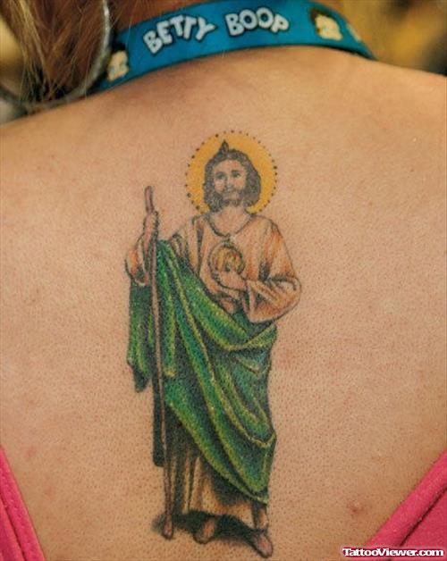 Colored Jesus Tattoo On Girl Upperback