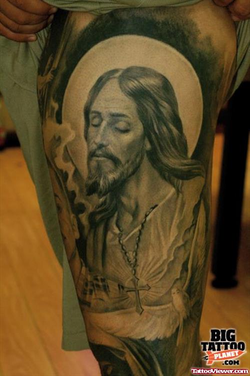 Grey Ink Jesus Tattoo On Left Leg