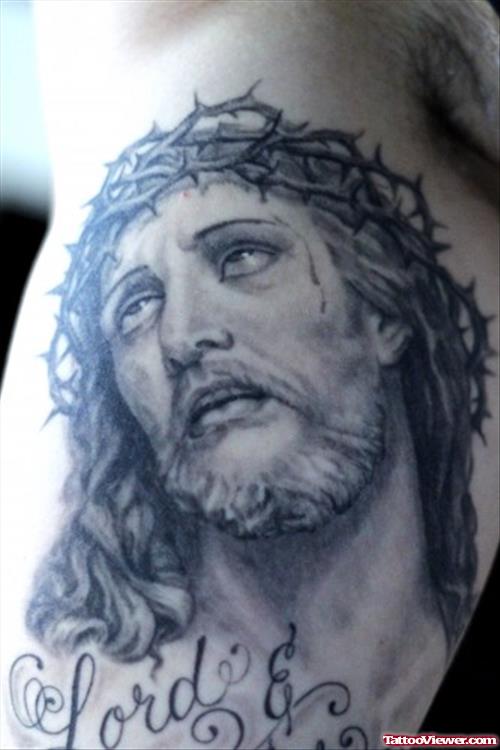 Grey Ink Jesus Tattoo On Inner Bicep