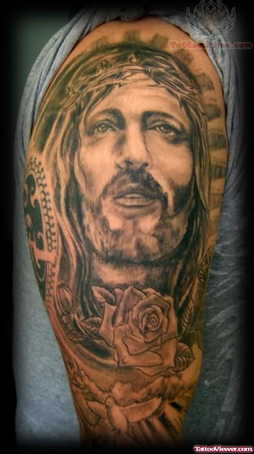 Grey Ink Jesus Head Tattoo On Right Half Sleeve