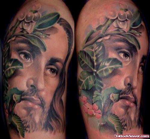 Green Leaves And Jesus Head Tattoo On Right Half Sleeve