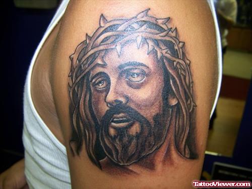 Grey Ink Jesus Tattoo On Left Shoulder
