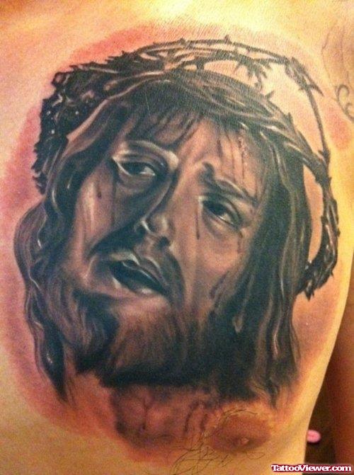 Grey Ink Jesus Head Tattoo On Man Chest