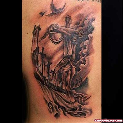 Grey Ink Cross And Jesus Face Tattoo