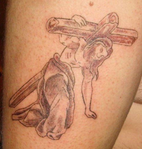 Grey Ink Jesus With Cross Tattoo On Bicep
