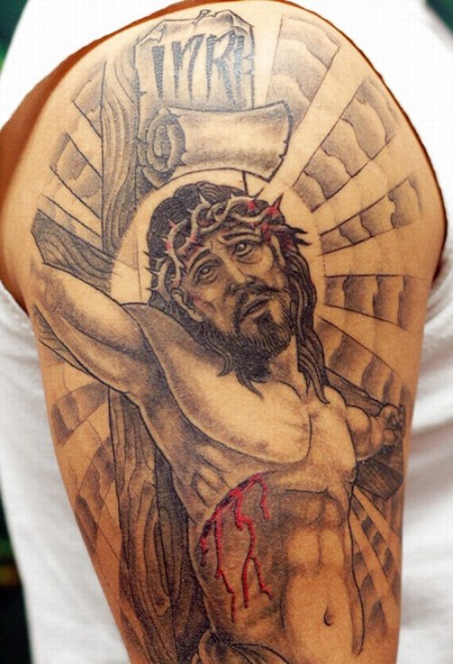 Grey Ink Jesus Tattoo On Man Right Sleeve