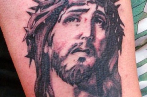 Amazing Grey Ink Jesus Head Tattoo On Bicep