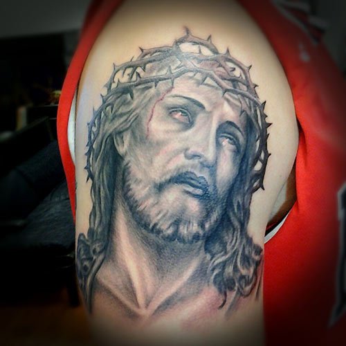 Grey Ink Jesus Head Tattoo On Man Right Shoulder