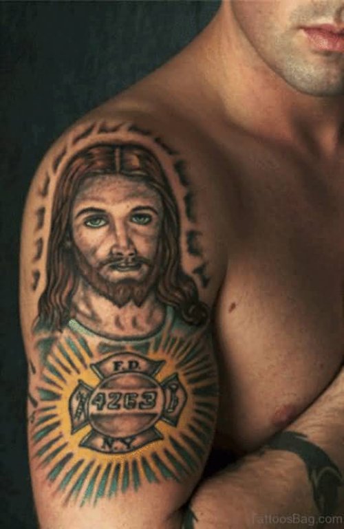 Man With Jesus Tattoo On Right Half Sleeve