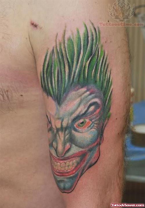 Laughing Joker Face Tattoo On Bicep