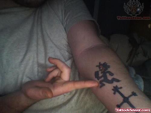 Juggalo And Cross Tattoo On Arm