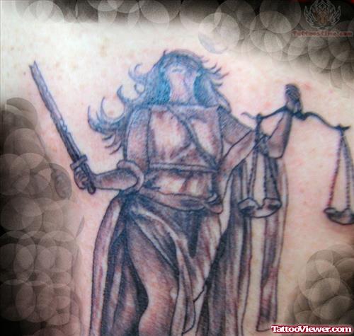 Grey Ink Justice Tattoo