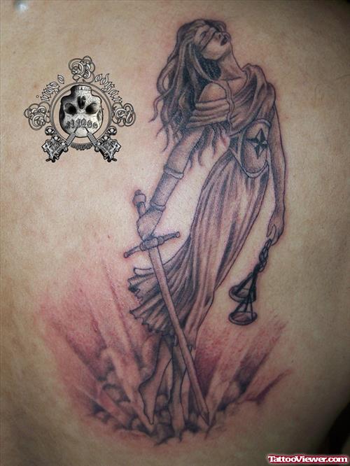 Grey Ink Justice Tattoo On Back