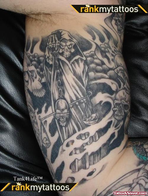 Grey Ink Grim Reaper Justice Tattoo On Inner Bicep