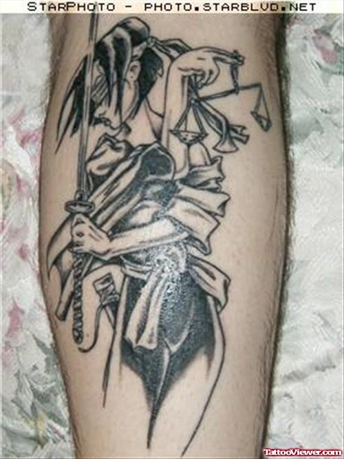 Grey Ink Lady Justice Tattoo On Leg