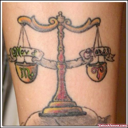 Colored Ink Justice Tattoo On Sleeve