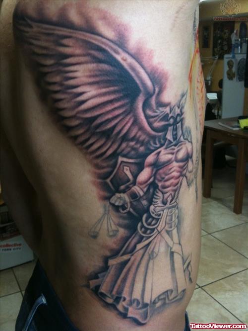 Grey Ink Angel Winged Justice Tattoo On Side Rib