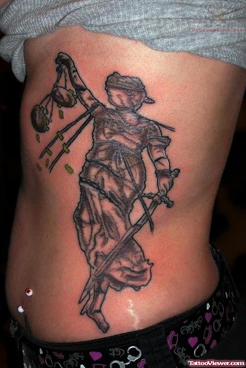 Attractive Grey Ink Justice Tattoo On Side Rib