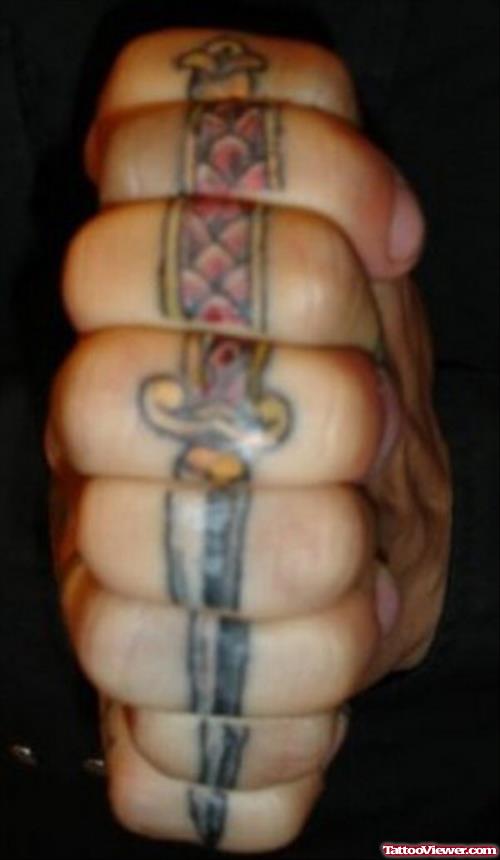 Justice Dagger Tattoo On Knuckles