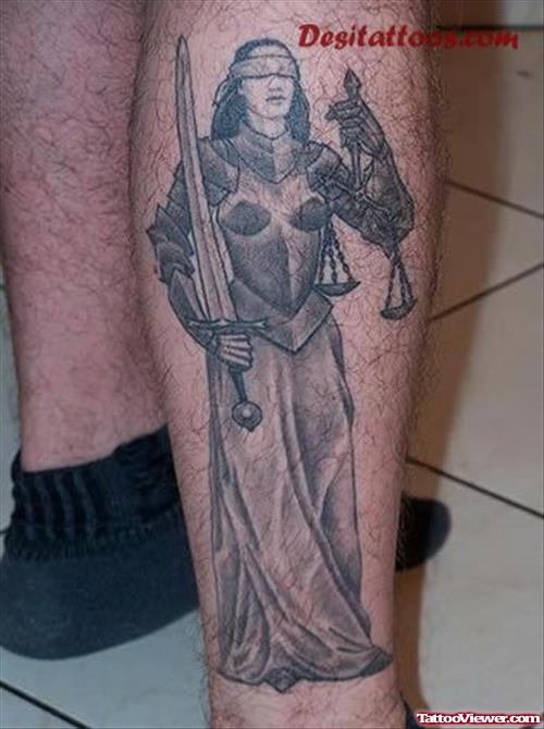 Amazing Grey Ink Justice Tattoo On Right Leg