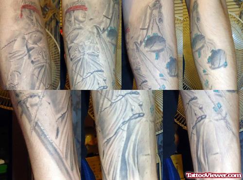 Grey Ink Justice Tattoo On Arm