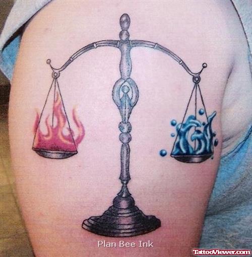 Colored Justice Scales Tattoo On Shoulder