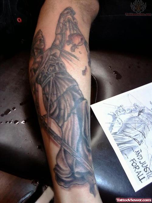 Awesome Grey Ink Justice Tattoo On Leg