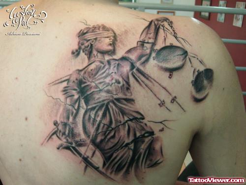 Grey Ink Justice Tattoo On Right Back Shoulder