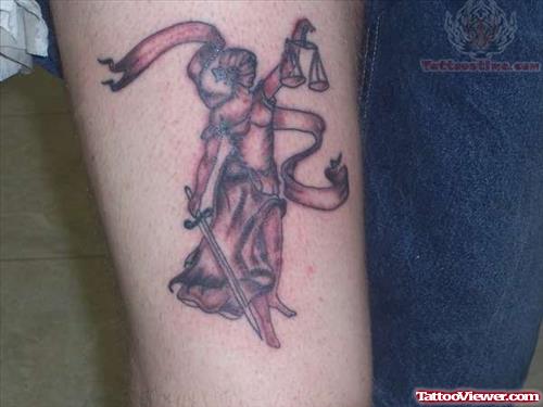 Grey Ink Banner And Justice Tattoo On Arm