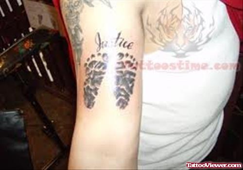 Justice Foot Prints Tattoo