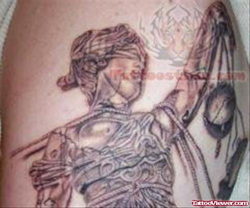 Justice Closeup Tattoo