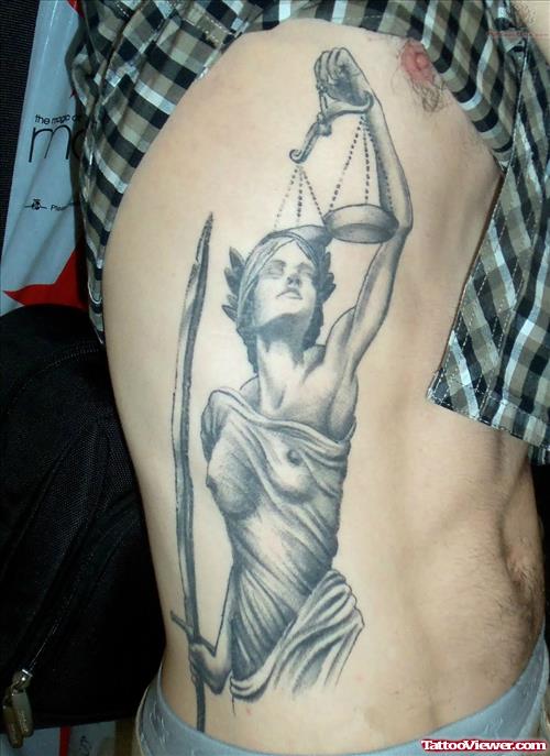 Lady Justice And Scales Tattoo On Rib