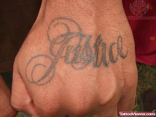Justice Tattoo On Hand Back