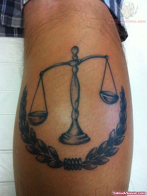 Justice Tattoo On Back Leg