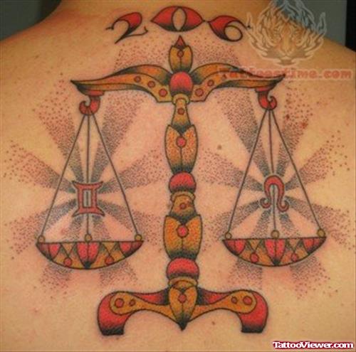 Color Ink Justice Tattoo On Back