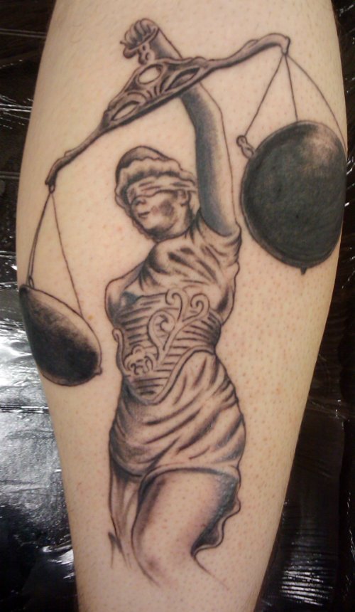 Awful Grey Ink Justice Tattoo On Leg