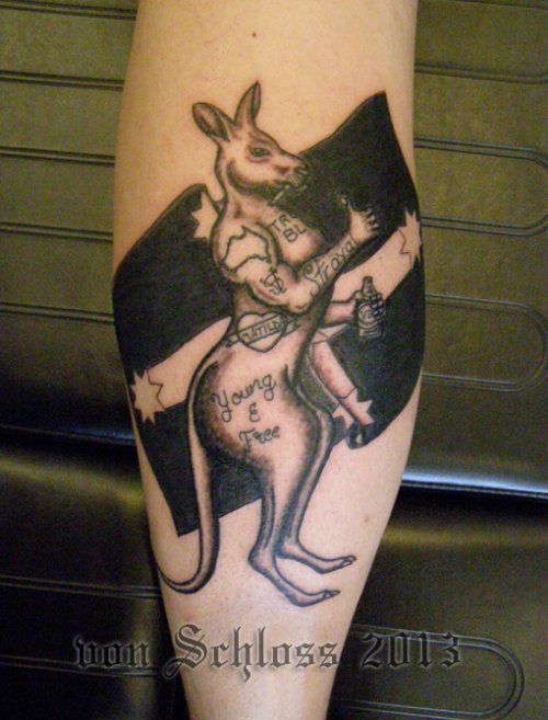Black And Kangaroo Tattoo On Back Leg
