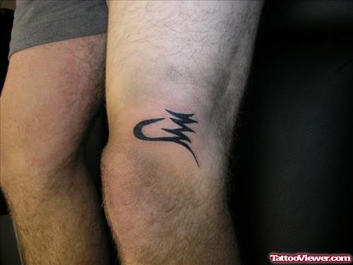 Symbol Tattoo On Knee