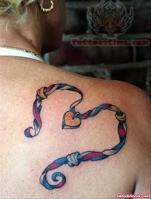 A Knot Tattoo On Back Shoulder