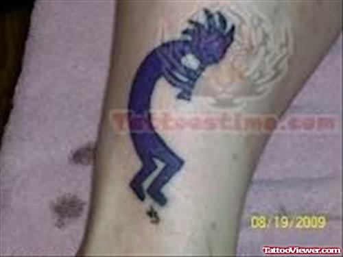 Purple ink Kokopelli Tattoo