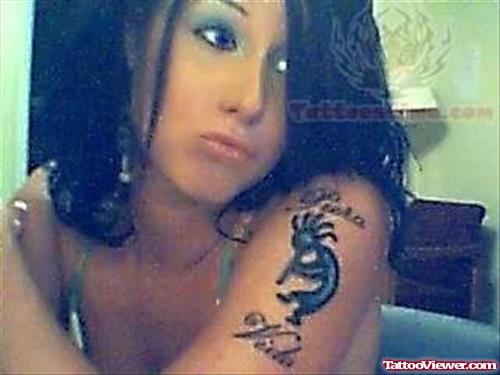 Kokopelli Tattoo on Girl Bicep