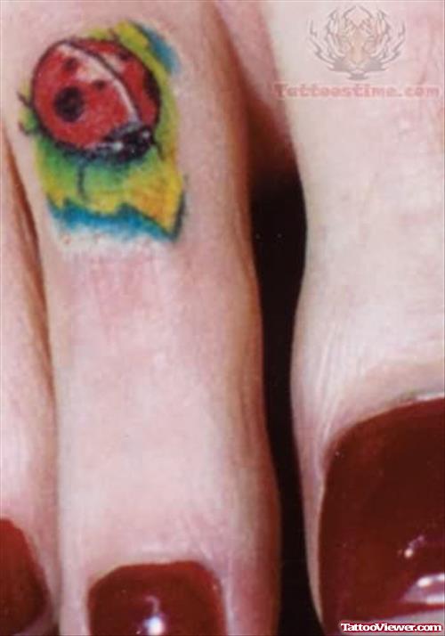 Ladybug Tattoo on Foot Finger